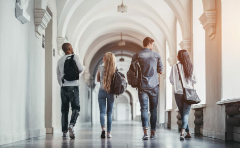 Multiracial,Students,Are,Walking,In,University,Hall,During,Break,And